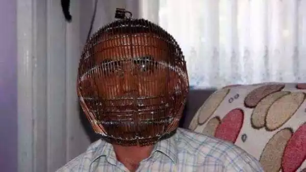 Lol! Man Locked His Head In A Cage To Quit Smoking During Ramadan [See Photo]